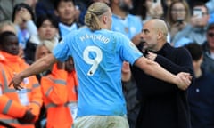 Erling Haaland shows Pep Guardiola his frustration at being substituted.