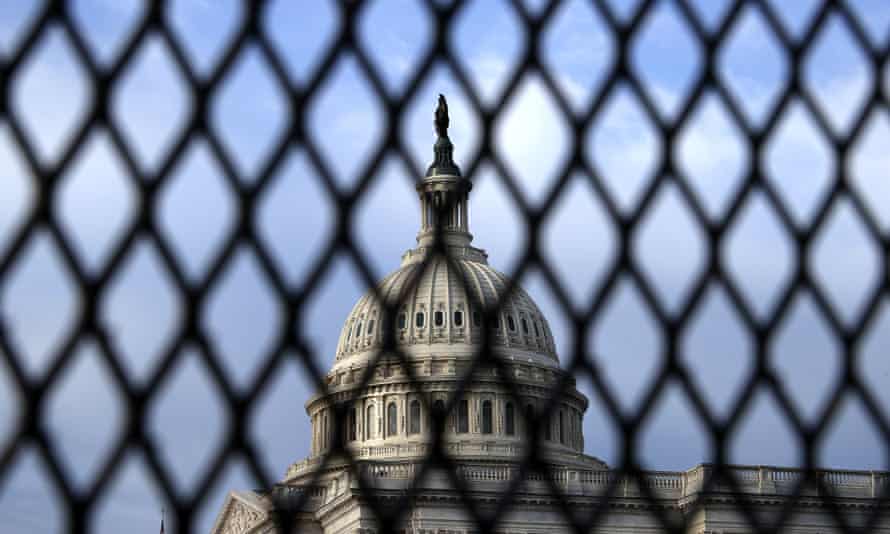 The US Capitol dome is seen through security fencing this month.