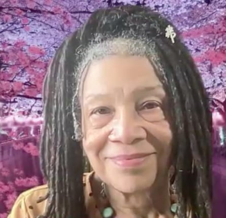 a women in front of purple background