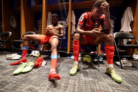 two men cool down in a locker room