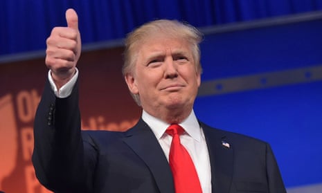 Donald Trump doing a thumbs-up hand signal.