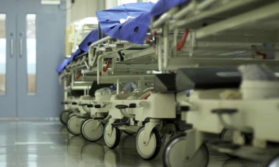 Hospital corridor with bed trolleys