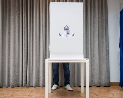A man casts his vote at a polling station during the Hungarian parliamentary elections in Budapest, Hungary.