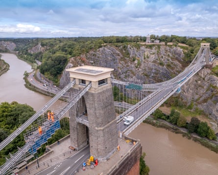 Workers in hi-vis clothing refurbish Clifton Suspension Bridge in Bristol