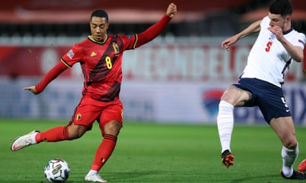 Belgium’s Youri Tielemans (left) scores the opening goal against England on Sunday despite Declan Rice’s attempt to block his shot.
