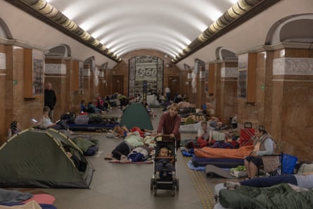 People take shelter at a metro station during Russian air attacks on Kyiv