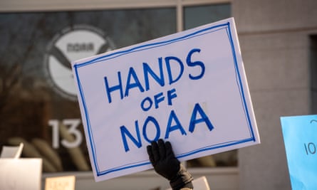 Protesters gather outside the headquarters of the National Oceanic and Atmospheric Administration (NOAA)