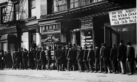 Unemployed men queuing fat a soup kitchen run by the Bahai Fellowship at 203 East 9th Street, New York, circa 1930.