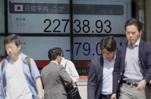 An electronic stock board showing Japan’s Nikkei 225 index at a securities firm in Tokyo today.