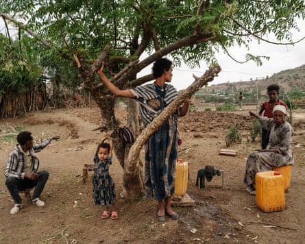 Civilians under tree