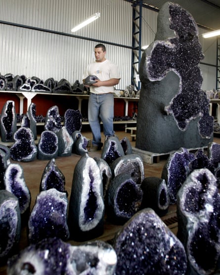 Hard labour: a worker grades amethysts by colour in Uruguay.