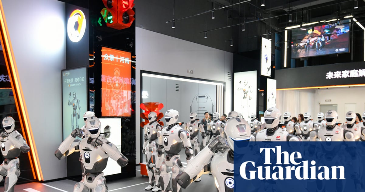 An FCC official bravely protecting America by pointing at a robot dog like it’s the opening shot of World War III.