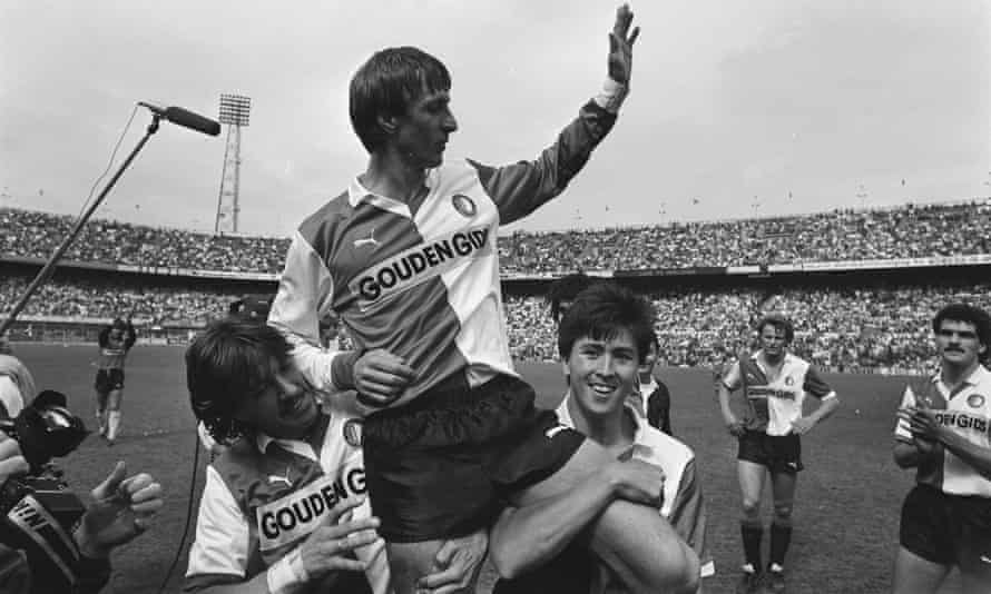 Johan Cruyff (c) is chaired around De Kuip Stadium