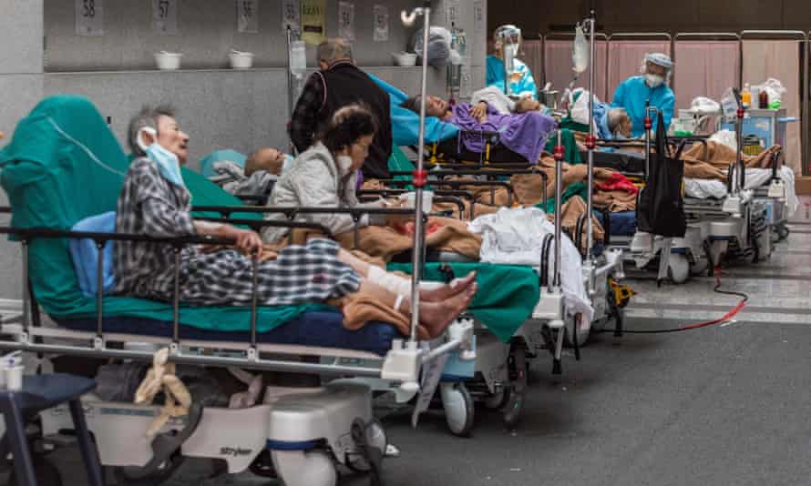 Health workers treat patients in a holding area next to the A&E department of Princess Margaret hospital in Hong Kong