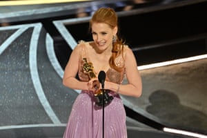 Jessica Chastain accepting the award for Best Actress or In They Eyes of Tammy Faye
