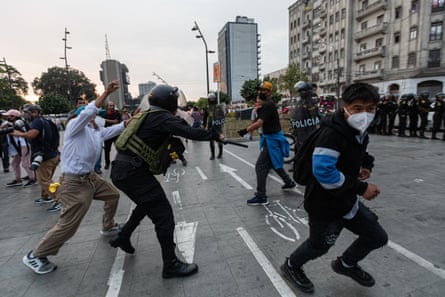 Police clash with protesters in Peru this week.