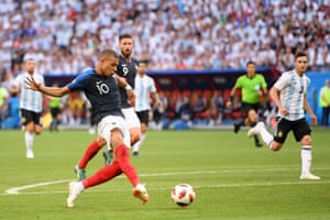 Mbappe of France scores his team’s fourth goal.