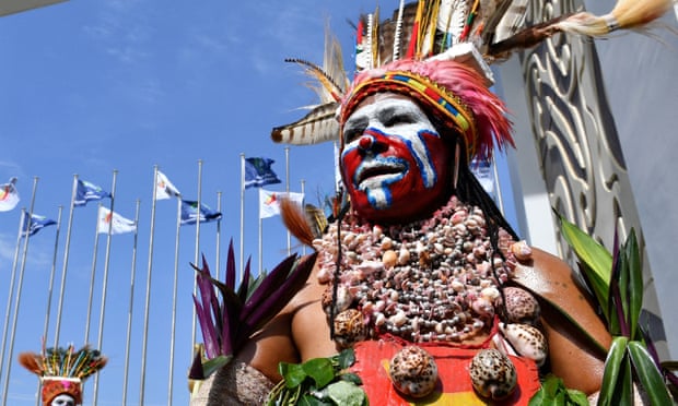 Performers in traditional costumes and headdress welcome ministers and delegates for the 30th Asia-Pacific Economic Cooperation (APEC) ministerial meeting in Port Moresby in 2018. 