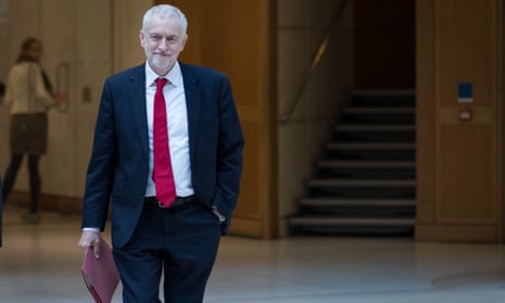 Jeremy Corbyn walks through Portcullis House in Westminster, on his way to meet Theresa May