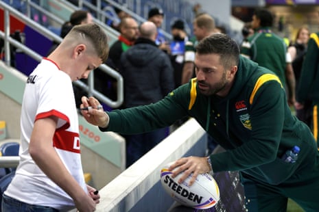 Australia's James Tedesco signs a fans shirt prior to kick-off.