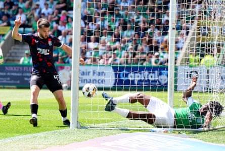 Hibernian’s Rocky Bushiri (right) clears the ball as Rangers’ Nicolas Raskin (left) claims it has crossed the line