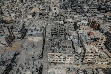 An aerial view of the heavily damaged, collapsed buildings of Khan Yunis after Israeli attacks