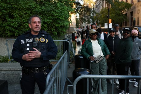 People wait to enter the court for the sentencing hearing of Sean "Diddy" Combs.