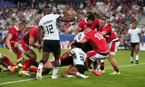 Wales’ Elliot Dee (hidden) scores their side’s fourth.
