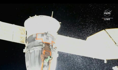 Video grab from a Nasa feed showing liquid spraying from the aft end of the Soyuz MS-22 spacecraft.