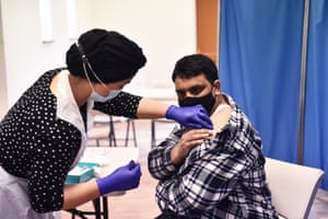 Sonia Akbar administers the AstraZeneca/Oxford Covid-19 vaccine to patients at a pop-up vaccination centre at the Pakistani community centre in Derby on 9 April.