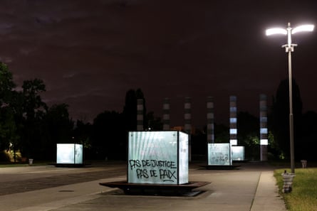 A sign that reads ‘No Justice, No Peace’ is painted on a crystal cube, in Nanterre, France