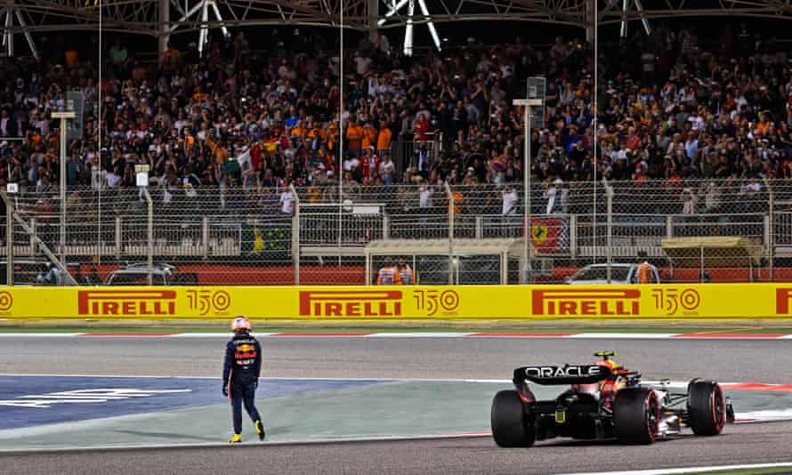 Max Verstappen walks away after retiring from the Bahrain Grand Prix due to mechanical failure.