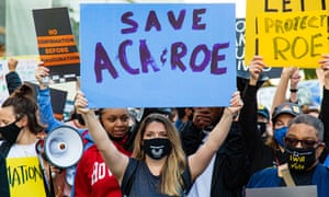 Protestors against Amy Coney Barrett’s nomination march to the Hart Senate building on Thursday.