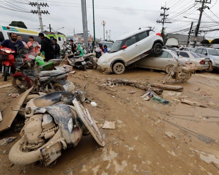 Damaged cars and motorbikes as flood waters begin to recede in Hat Yai, in southern Thailand’s Songkhla province