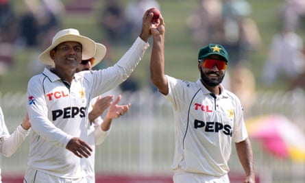 Pakistan's Noman Ali (left) and Sajid Khan walk off after taking all 10 England wickets between them.