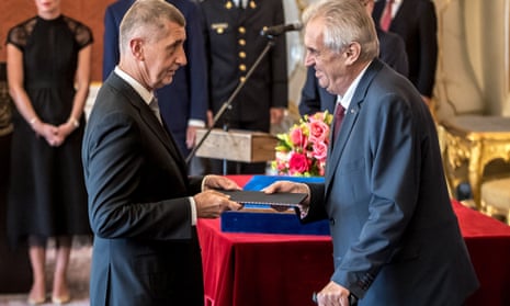 Andrej Babiš, left, receives documents from Miloš Zeman, the populist Czech president, in Prague
