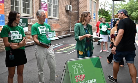 Greens candidate for Balmain Kobi Shetty speaks to voters before casting her vote at Orange Grove Public School.