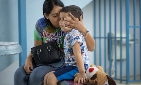 Shaina kisses her son Keydiel, five, in the yard of the school he attends in Yabucoa, Puerto Rico.