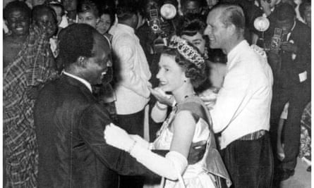 The Queen in long gloves dances with Ghana’s president Kwame Nkrumah, holding the upper sleeve of his jacket