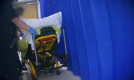 An ambulance crew member leaves a patient in the reception at Royal Shrewsbury’s A&E.
