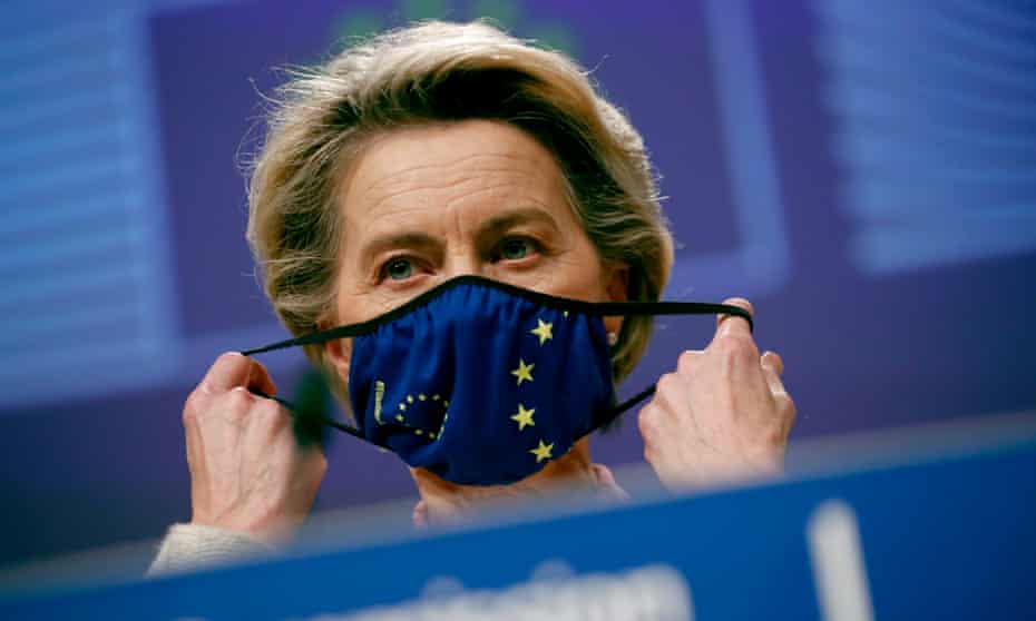 Ursula von der Leyen puts on an EU facemask after addressing a media conference on the Brexit negotiations