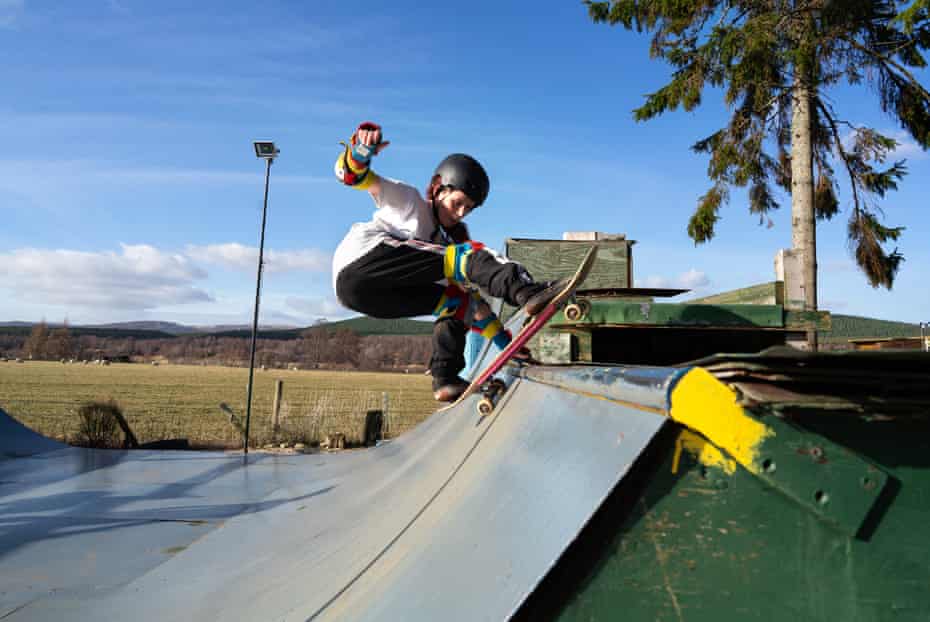 Scottish skater Emily Rothney poses a frontside rock on her mini garden ramp in Carrbridge, in the Highlands of Scotland. She skates here every day with her sister Rosie.