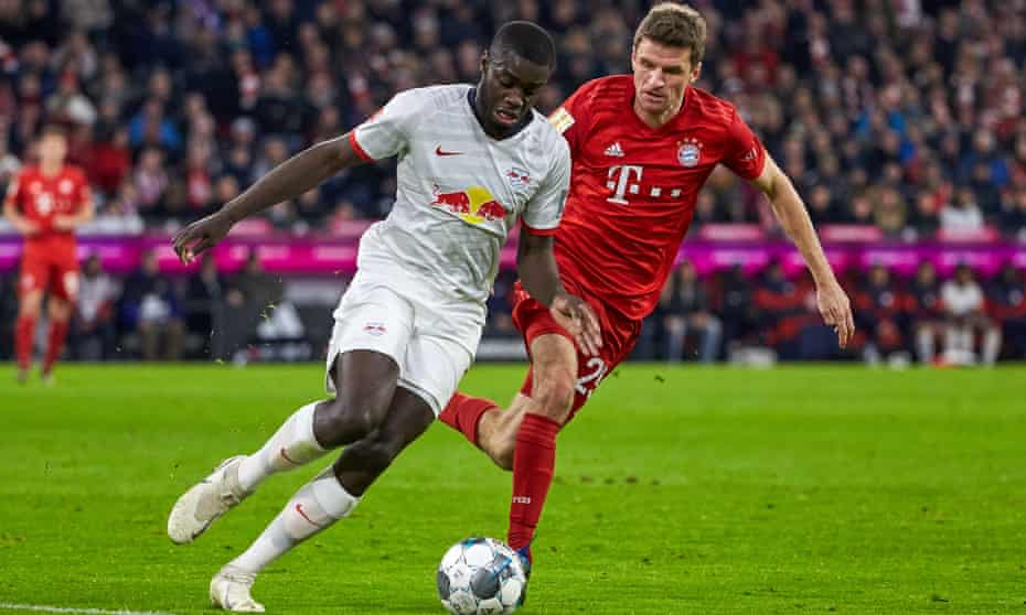 Dayot Upamecano battles with Bayern Munich’s Thomas Müller in February 2020.