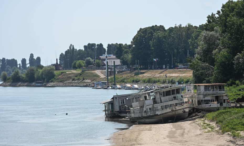 Boats lie on a desiccated bank of the River Po in Boretto, Italy.
