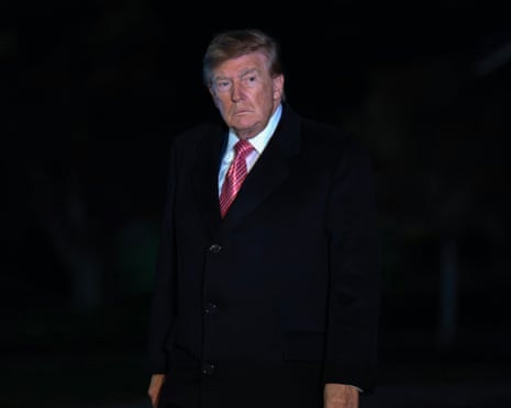 President Donald Trump walks on the south lawn upon his arrival to the White House on 18 October.