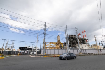 a car in front of a liquefied natural gas terminal