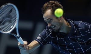 Daniil Medvedev returns the ball to Rafael Nadal .