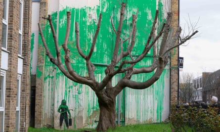 Banksy tree mural.