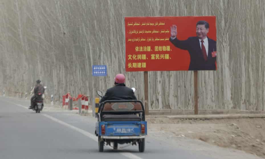 Chinese President Xi Jinping is seen on a billboard in Yarkent County in northwestern China's Xinjiang Uyghur Autonomous Region
