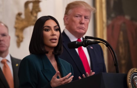 Kim Kardashian at the White House as Donald Trump looks on.
